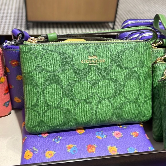 Coach Handbags - Coach Corner Zip Wristlet In Signature Canvas
Im/Neon Green